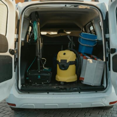 Yellow and Blue Plastic Trash Bin in White Car